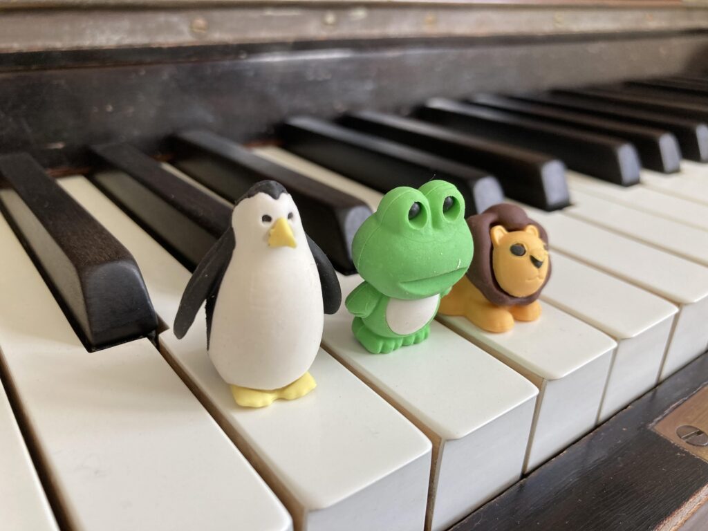Small Toys on piano keys